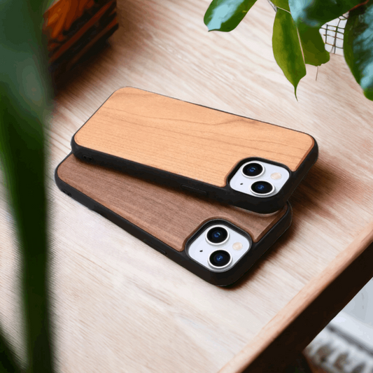 Phones with wooden phone cases on a table