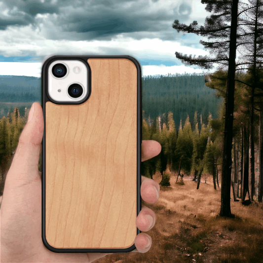 a person holding an iphone with a wooden phone case