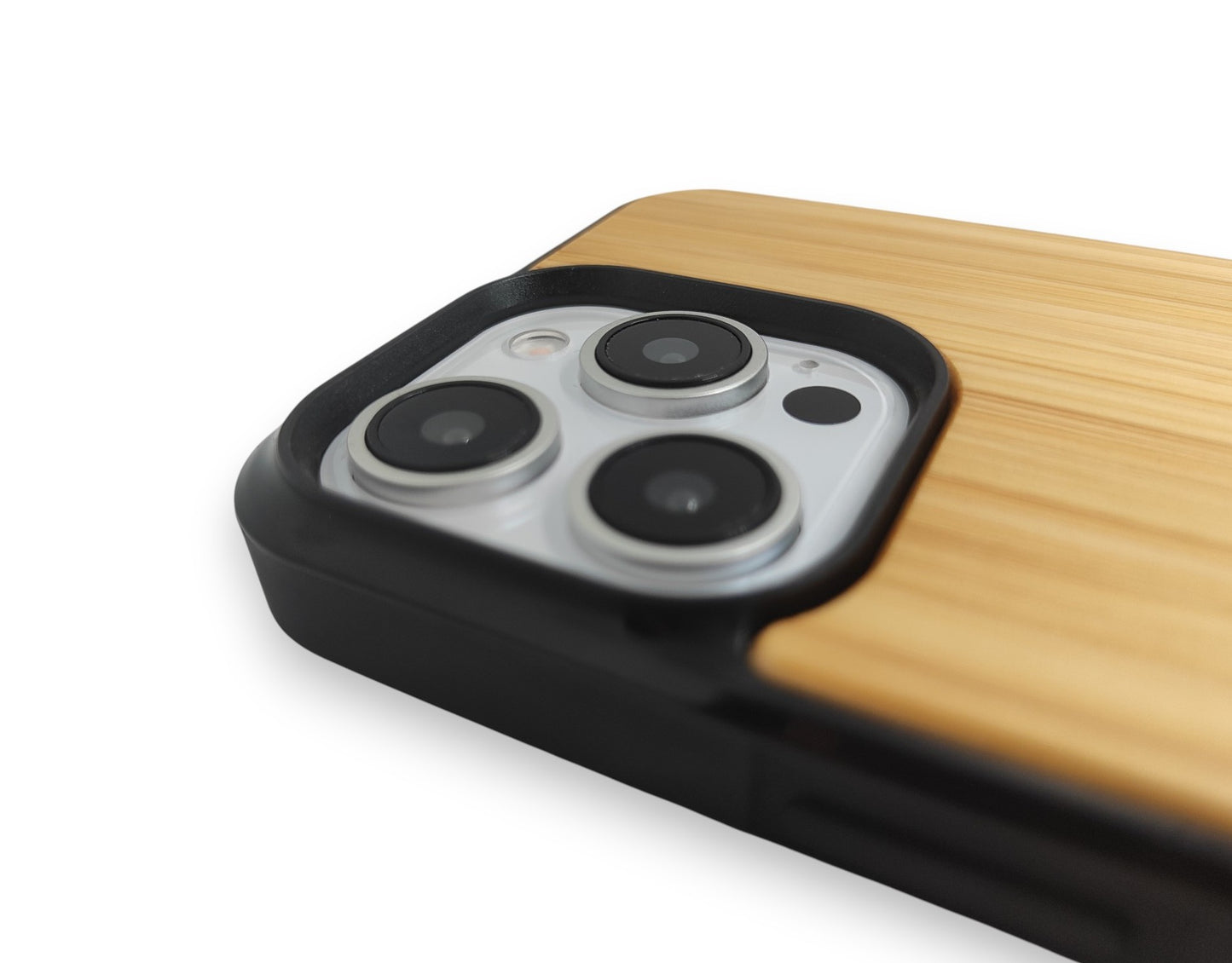 Close-up of a phone case with wooden finish and camera module on a white background