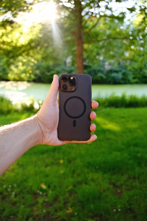 A person holding a Magsafe phone case
