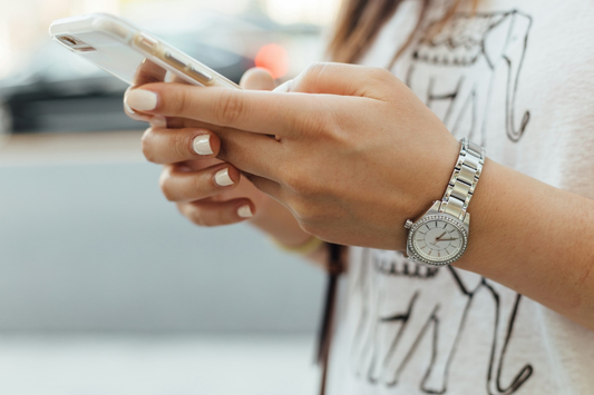 a person holding a phone in their hand 