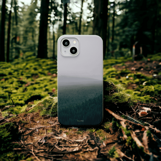 A Phone Case with a Morning Forest Graphic in the Middle of a Forest