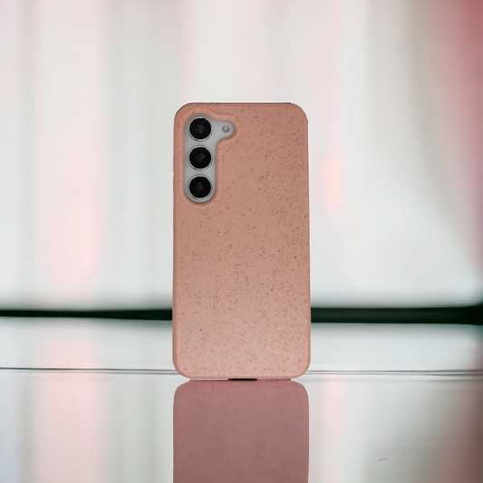 A Pink Solid Color Phone Cover on a Reflective Surface
