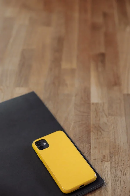 A collection of traditional plastic phone cases displayed on a table