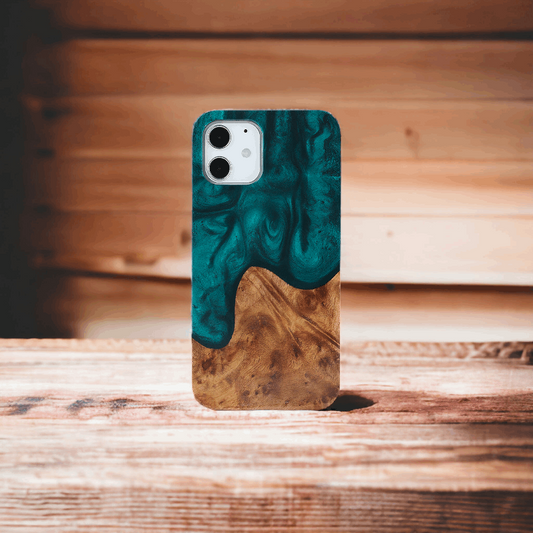A Malachite Green Wood and Resin Phone Case on a Wooden Surface