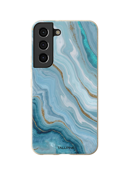 Phone case with blue and gold marbled pattern on a white background